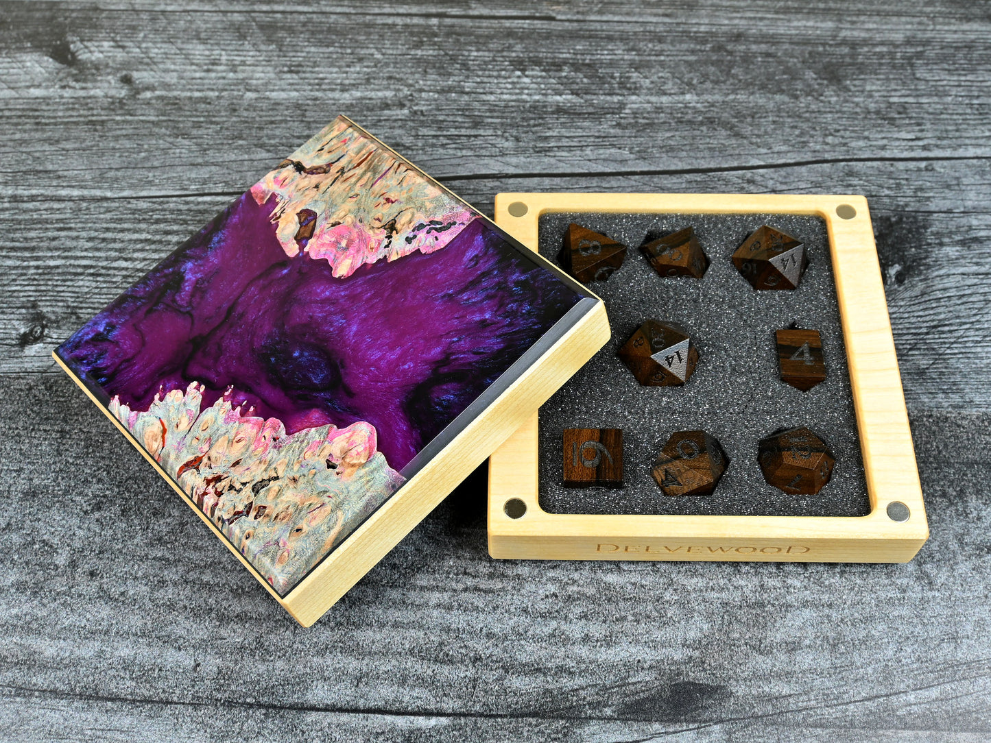 This Little Delver Dice Box features a birch wood core and a maple burl top veneer with black and fuchsia resin. D&D ttrpg.