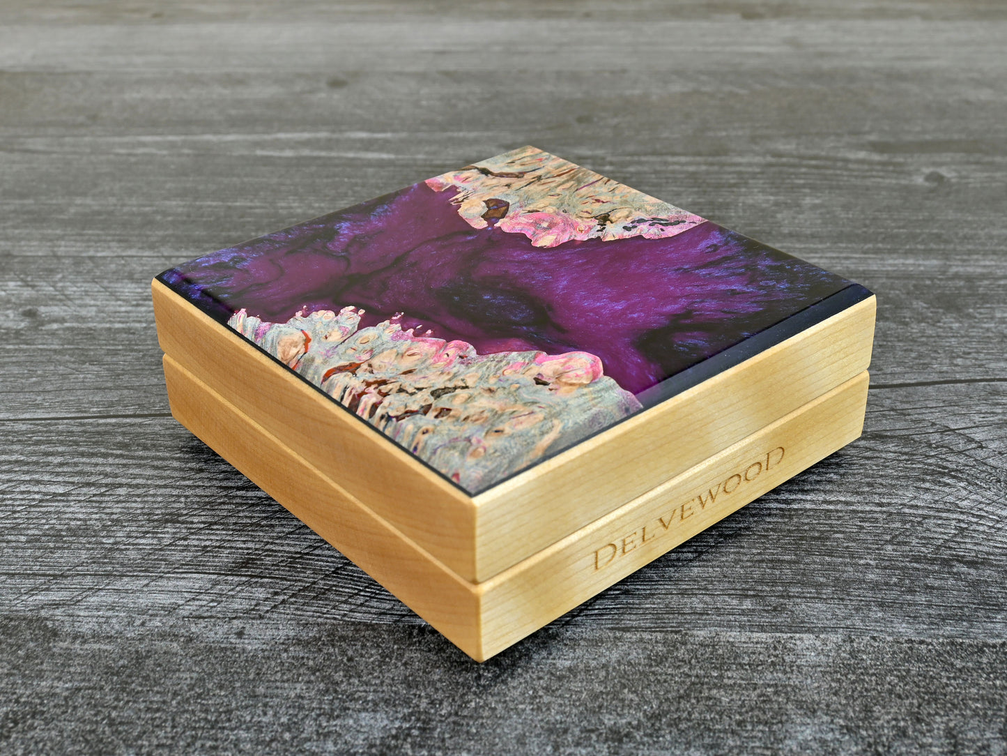 This Little Delver Dice Box features a birch wood core and a maple burl top veneer with black and fuchsia resin. D&D ttrpg.