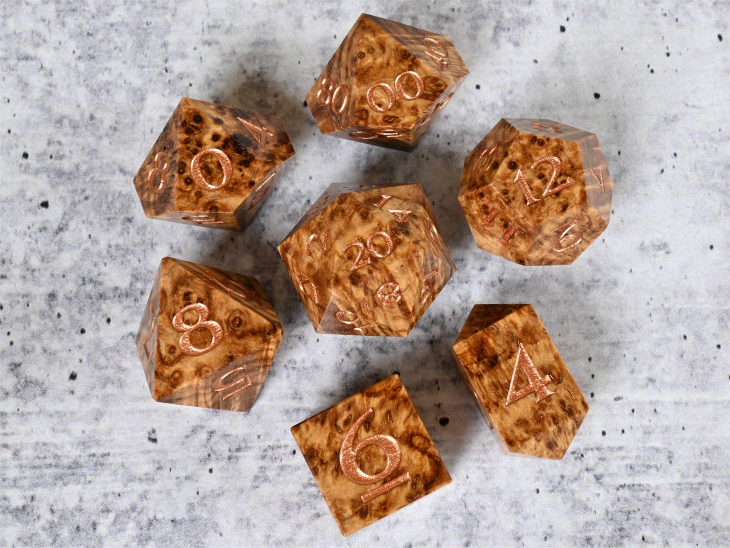 Dye stabilized black ash burl wood dice set with bronze painted numbers for dnd ttrpg