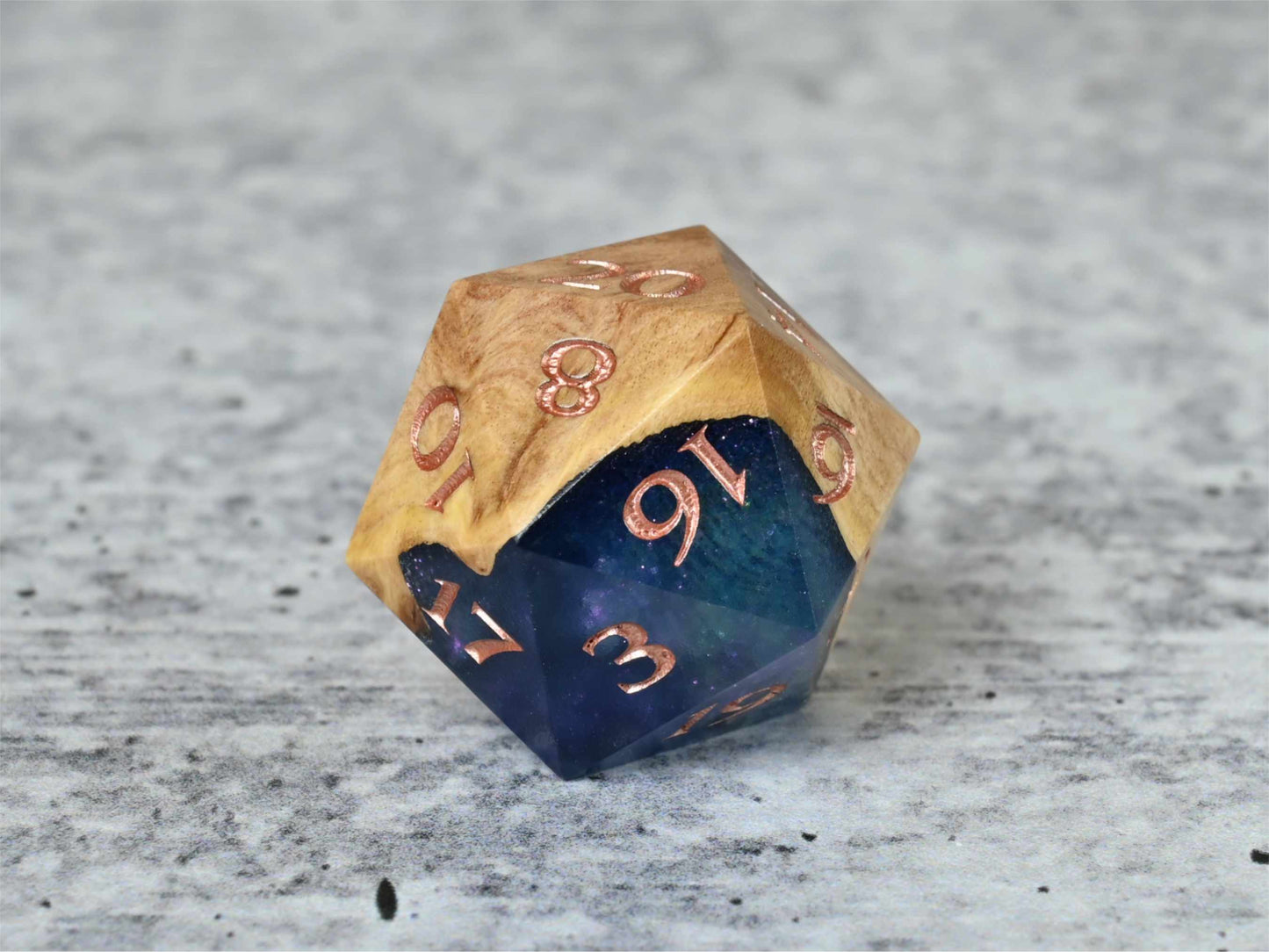 Celestial Solstice Red Mallee Burl D20 dice with numbers painted rose gold for dnd ttrpg