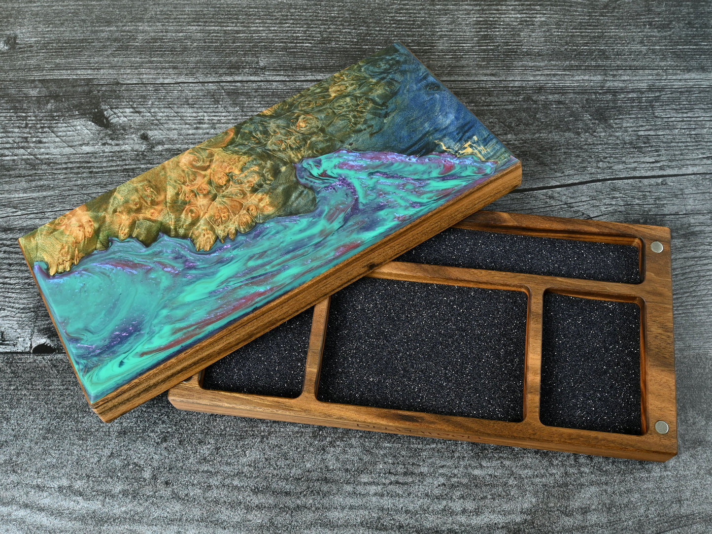This Delver's Kit Dice Box features a Patagonian rosewood core and an Bluegreen maple burl top veneer with blue, purple, and fuchsia resin. D&D ttrpg.