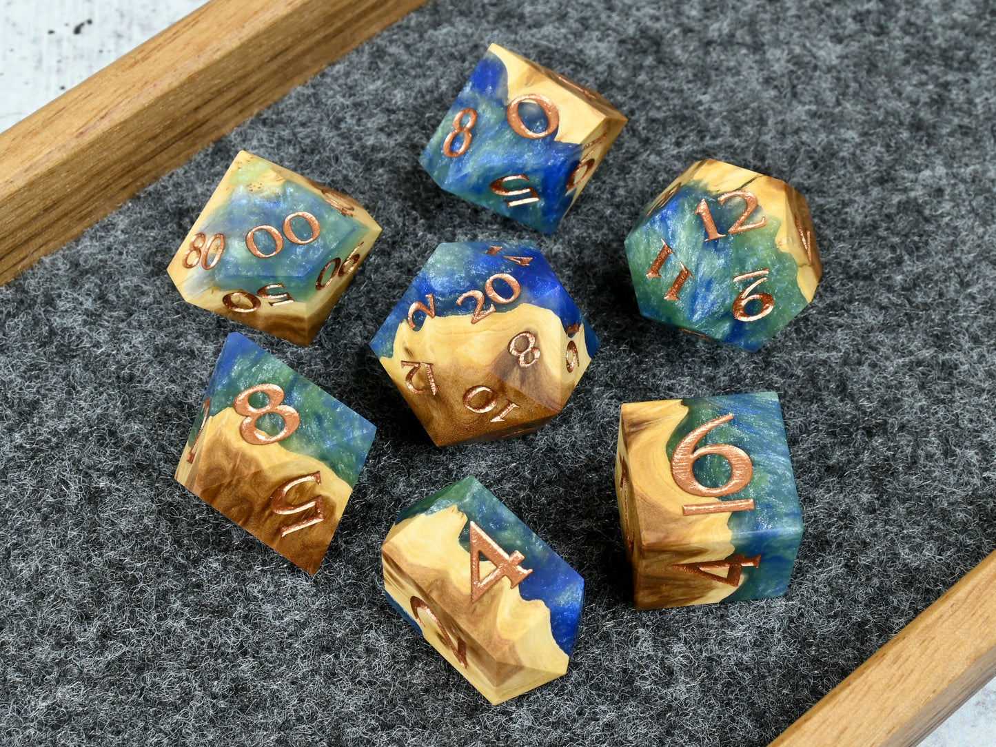 Earth magic brown mallee burl wood and resin hybrid dice set for D&D ttrpg.