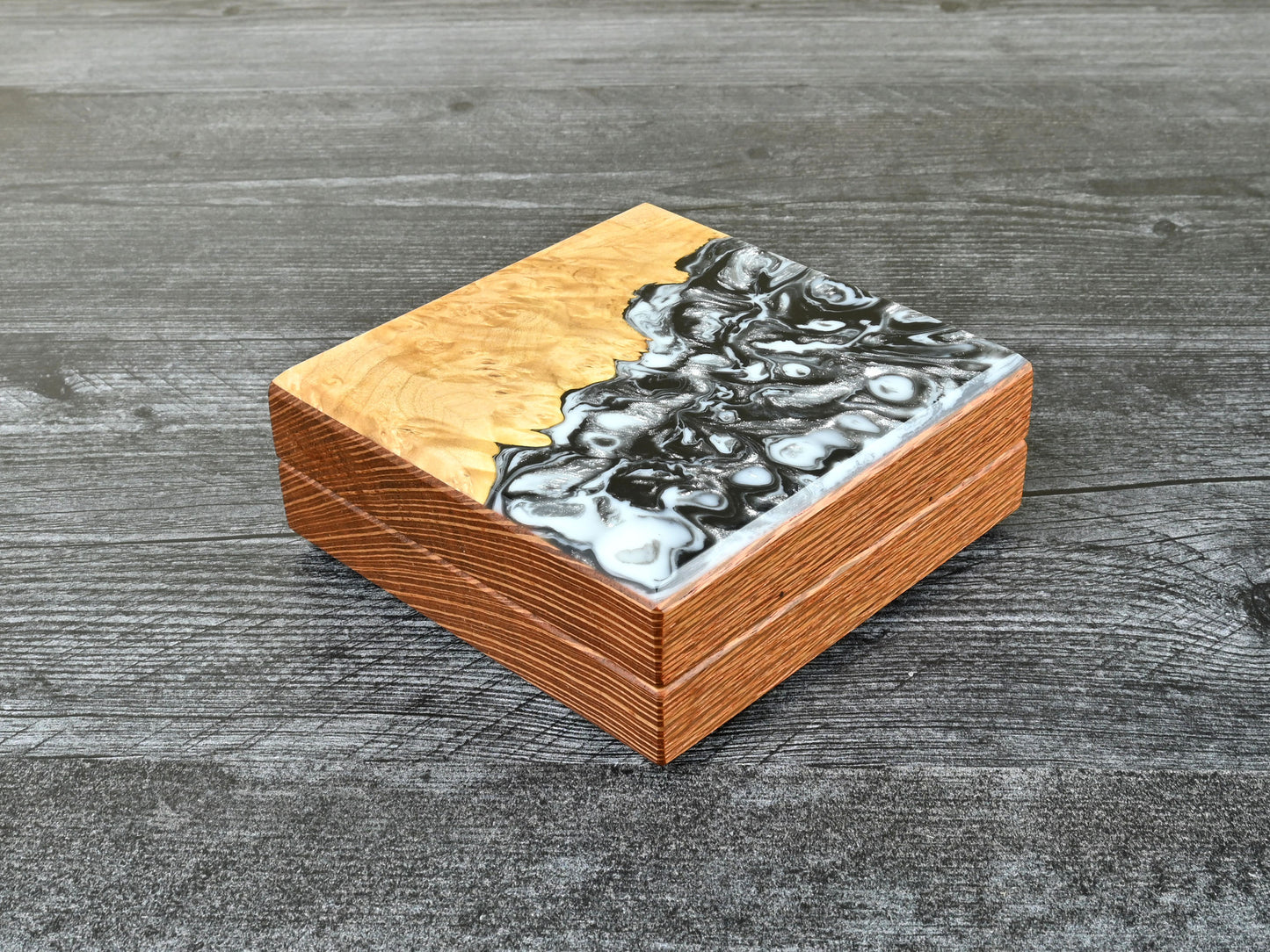 This Little Delver Dice Box features a lacewood core and a maple burl top veneer with black, white, and silver resin. D&D ttrpg.