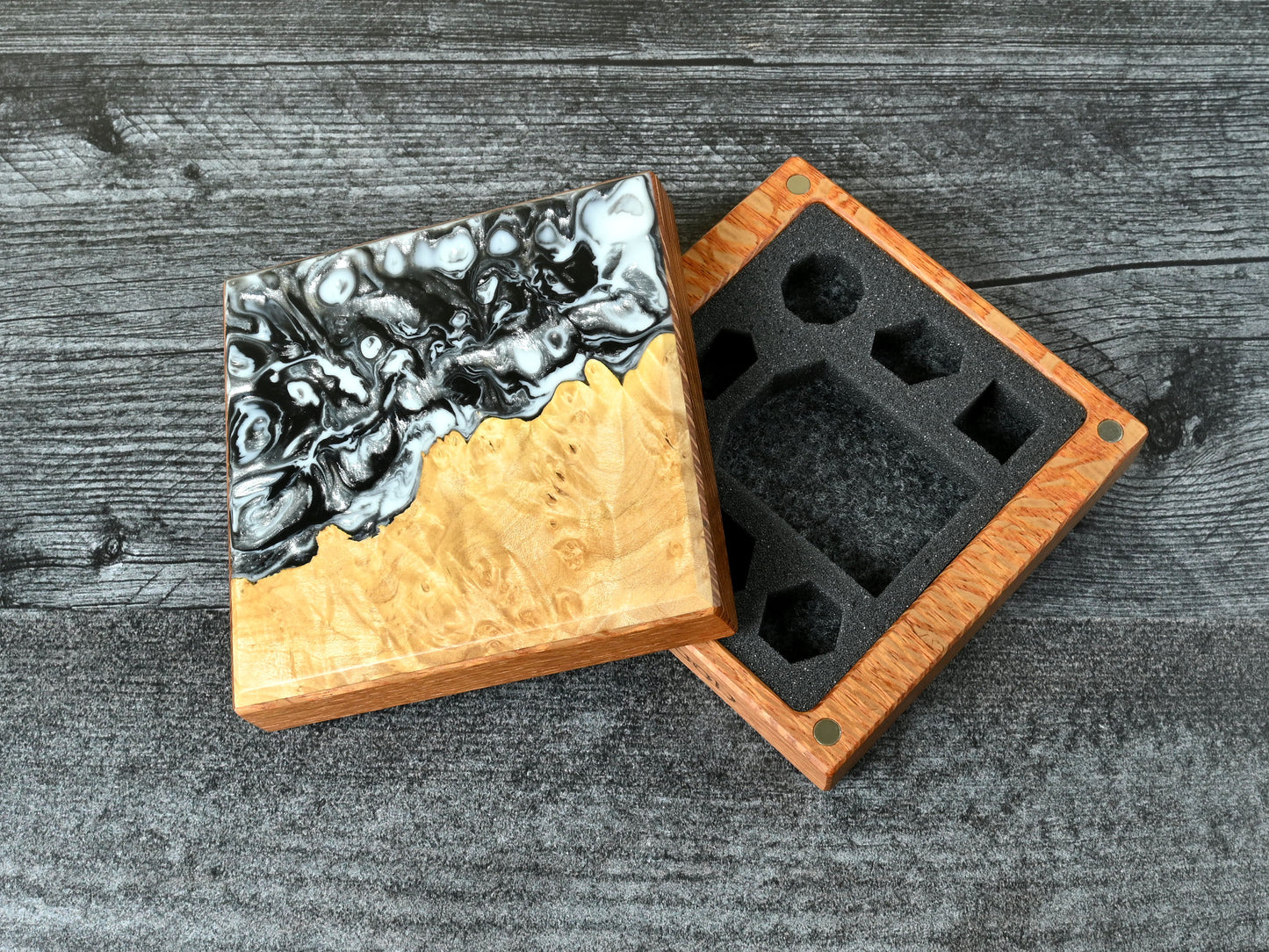 This Little Delver Dice Box features a lacewood core and a maple burl top veneer with black, white, and silver resin. D&D ttrpg.