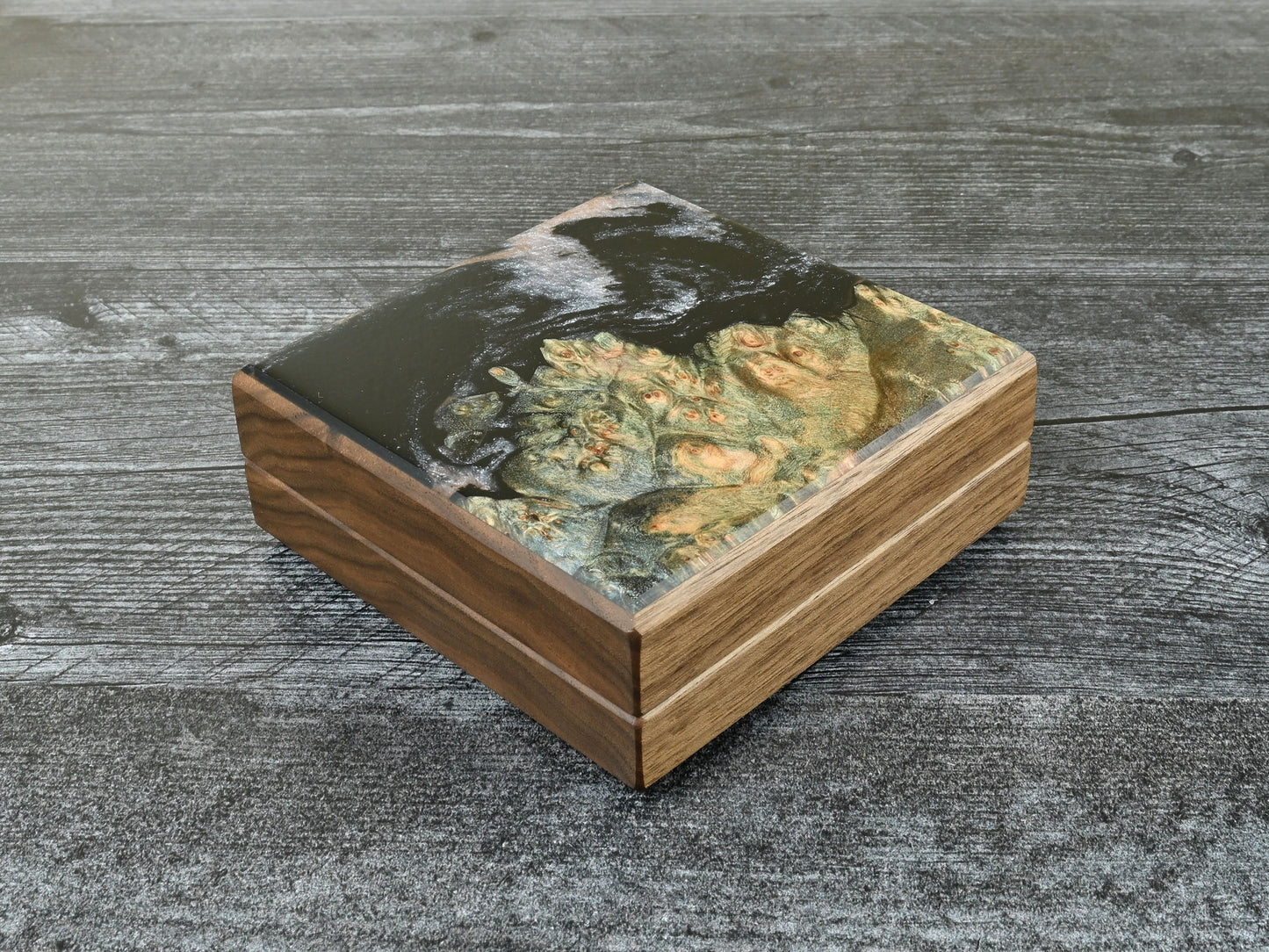 Walnut little delver dice box with green/blue maple burl top veneer and black / pearl white resin. D&D ttrpg.