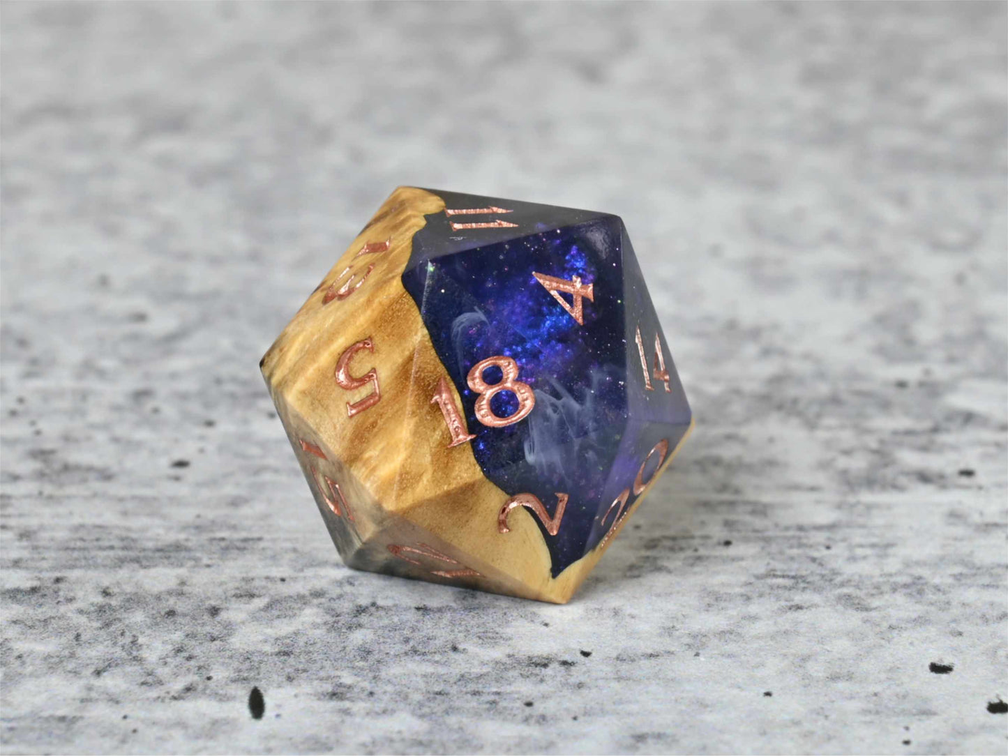 Cloud Nebula Buckeye Burl wood and resin D20 dice with numbers painted rose gold for dnd ttrpg