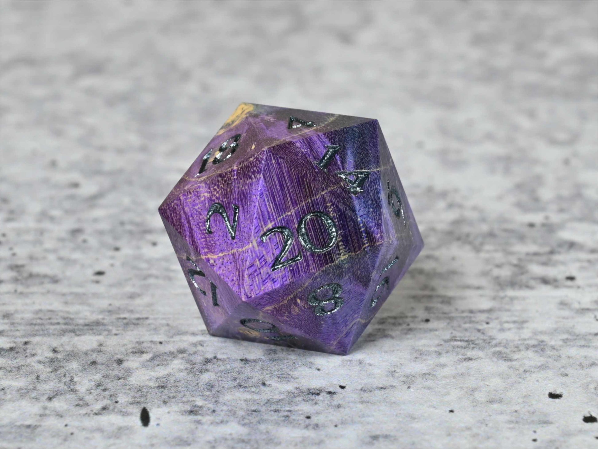 Purple and blue dye stabilized box elder burl wood d20 with dark sliver painted numbers for dnd ttrpg