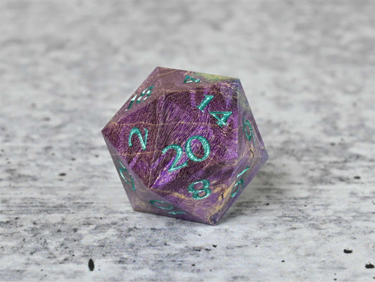 Purple and teal dye stabilized box elder burl wood d20 with teal painted numbers for dnd ttrpg