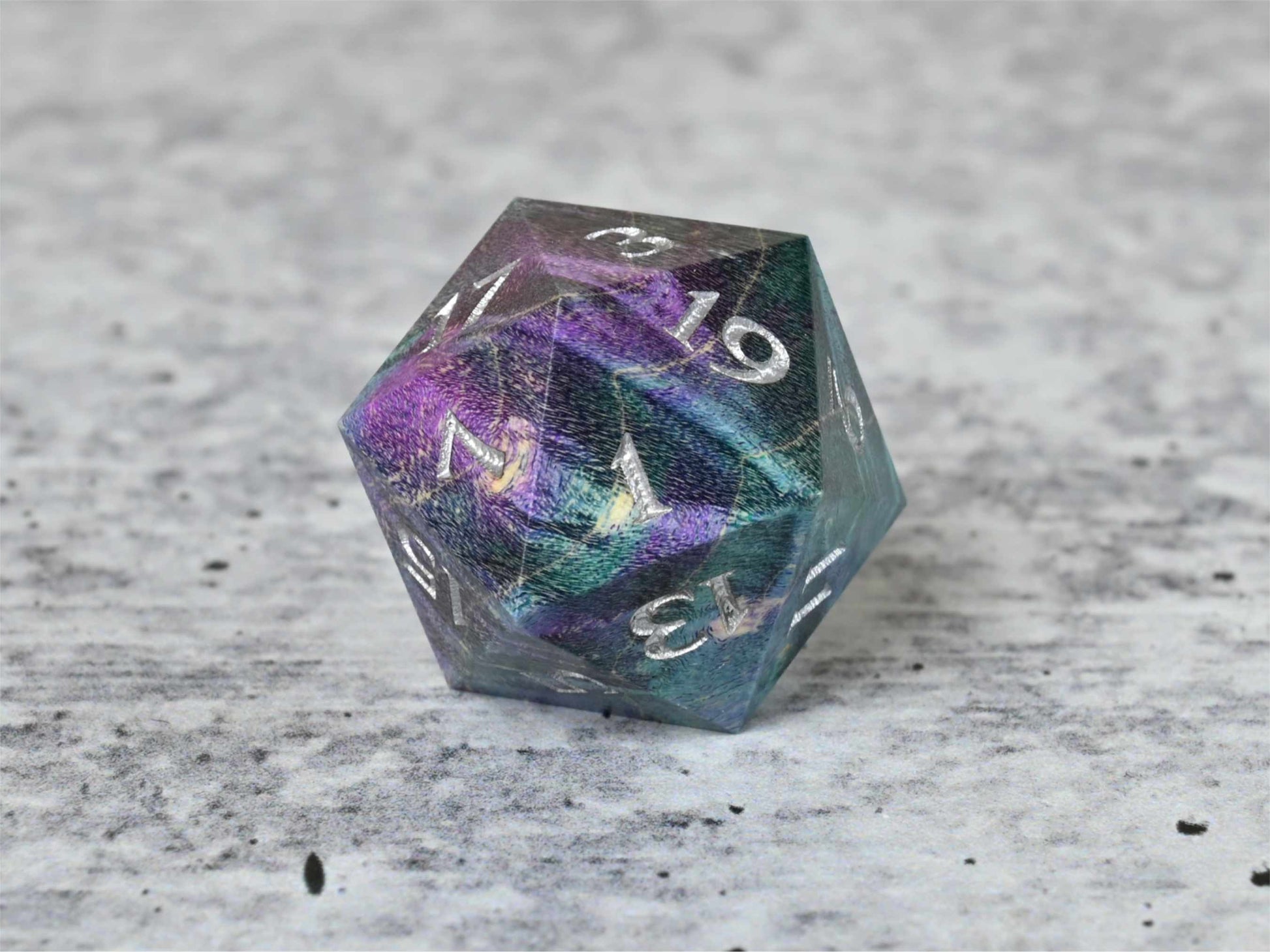 Teal and purple dye stabilized box elder burl wood d20 with silver painted numbers for dnd ttrpg