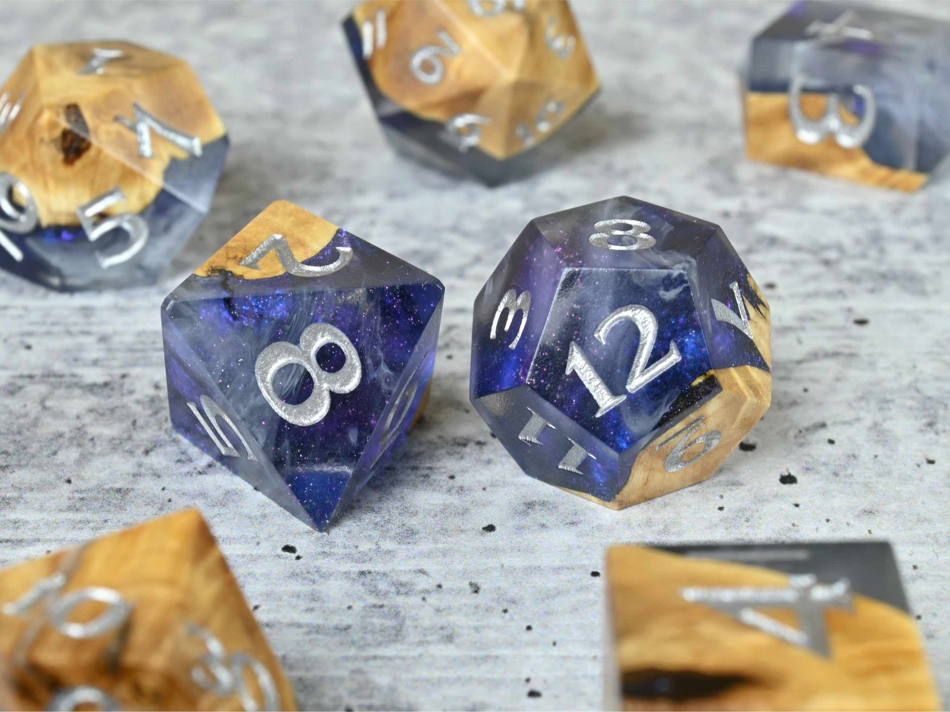 Cloud Nebula Buckeye burl wood and resin dice set with silver painted numbers for dnd tabletop rpg
