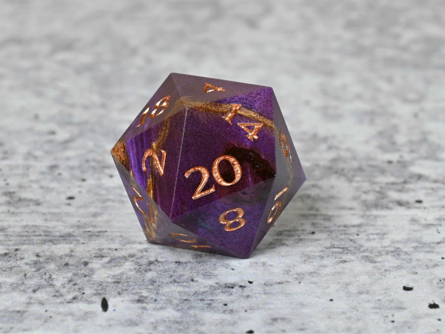 Purple dye stabilized buckeye burl wood d20 with rose gold painted numbers for dnd ttrpg