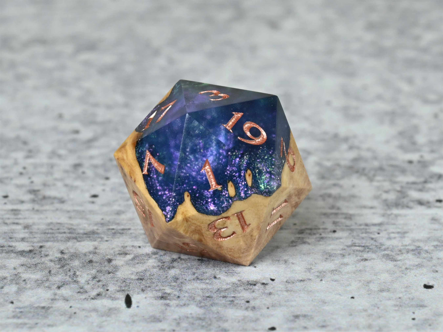 Celestial Solstice Red Mallee Burl D20 dice with numbers painted rose gold for dnd ttrpg