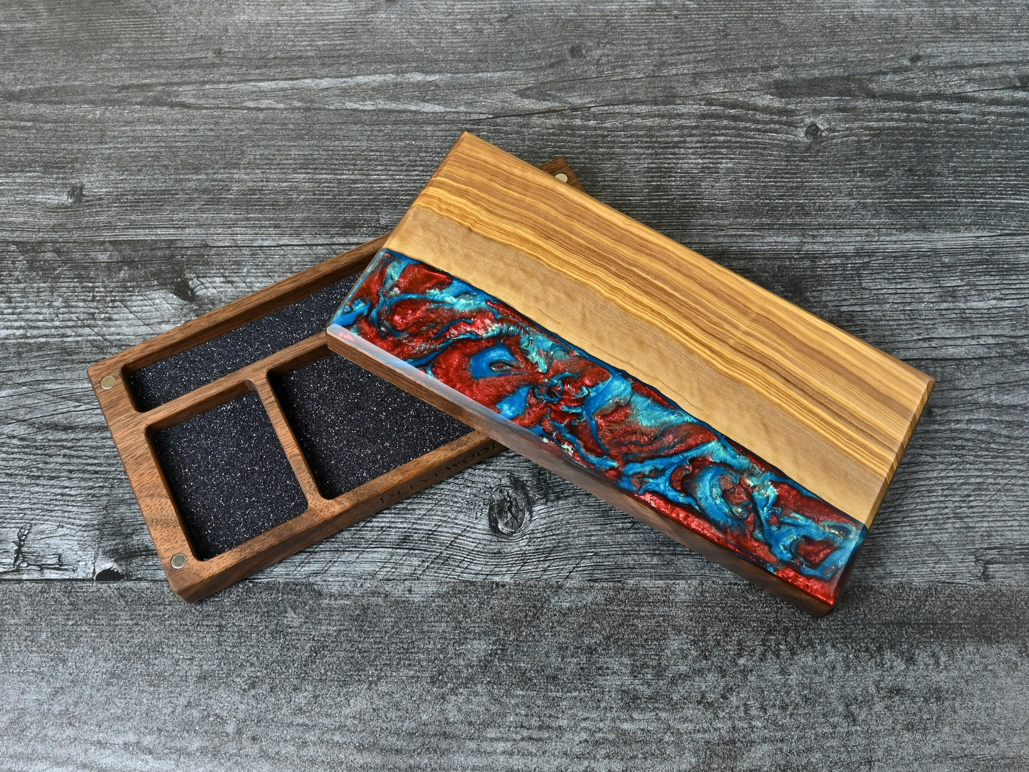 Delver's Kit Dice Box featuring a walnut core and an olivewood top veneer with blue and red resin. Made for D&D ttrpg.