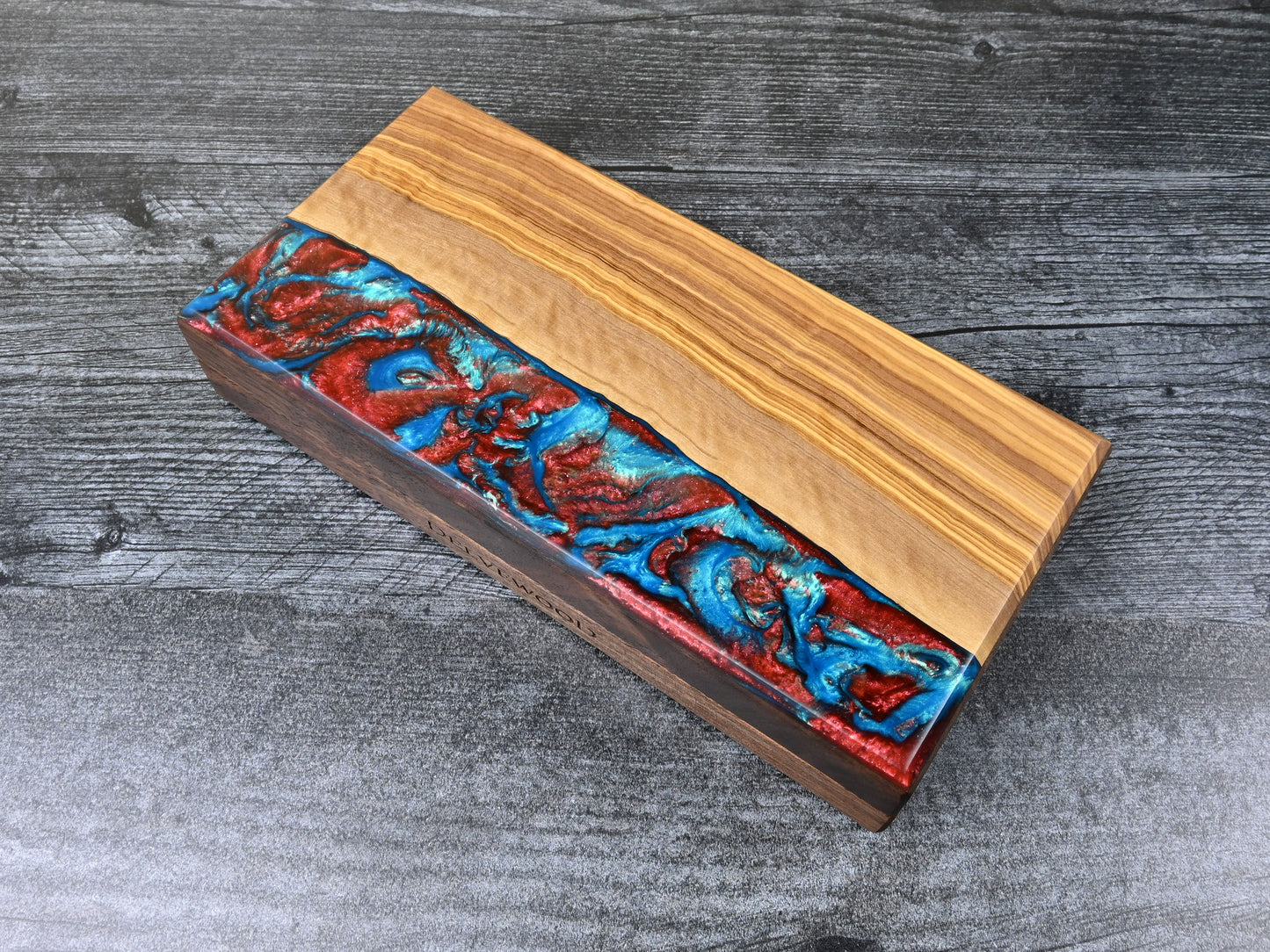 Delver's Kit Dice Box featuring a walnut core and an olivewood top veneer with blue and red resin. Made for D&D ttrpg.