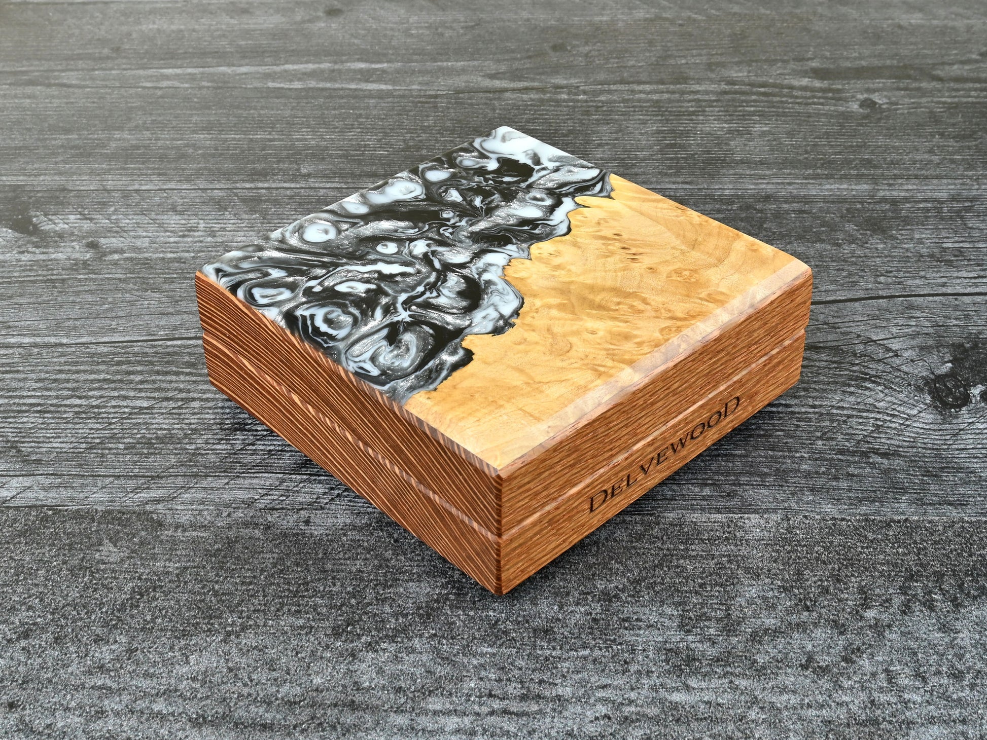 This Little Delver Dice Box features a lacewood core and a maple burl top veneer with black, white, and silver resin. D&D ttrpg.