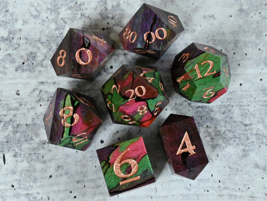 Purple, teal and pink dye stabilized spalted maple wood dice set with rose gold painted numbers for dnd ttrpg