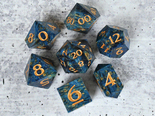 Blue dye stabilized black ash burl wood dice set with gold painted numbers for dnd ttrpg
