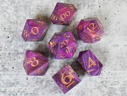 Purple and pink dye stabilized box elder burl wood d20 with rose gold painted numbers for dnd ttrpg