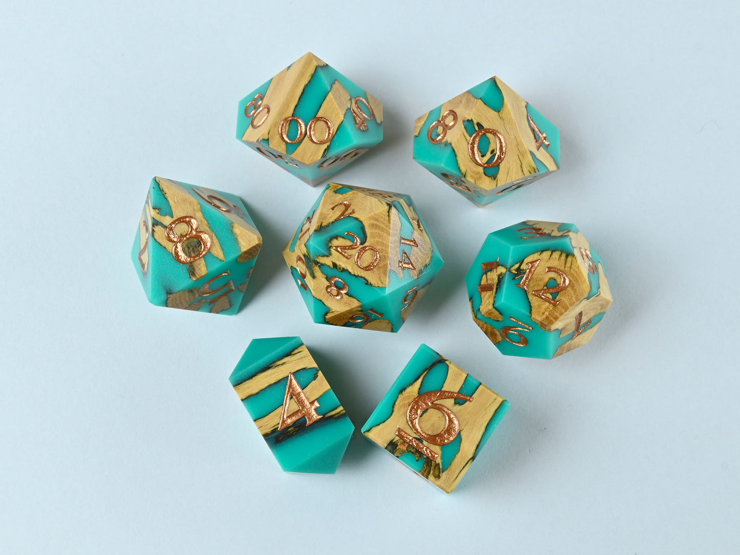 Turquoise cholla wood and resin hybrid dice set with bronze numbers for dnd ttrpg