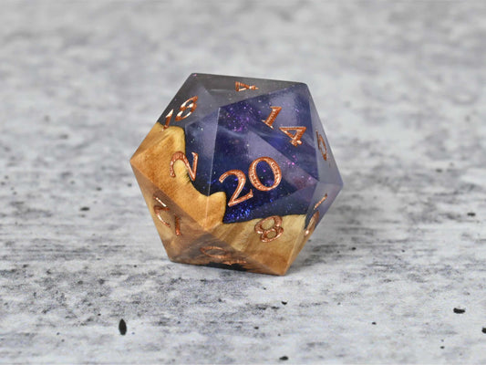 Cloud Nebula Buckeye Burl wood and resin D20 dice with numbers painted rose gold for dnd ttrpg