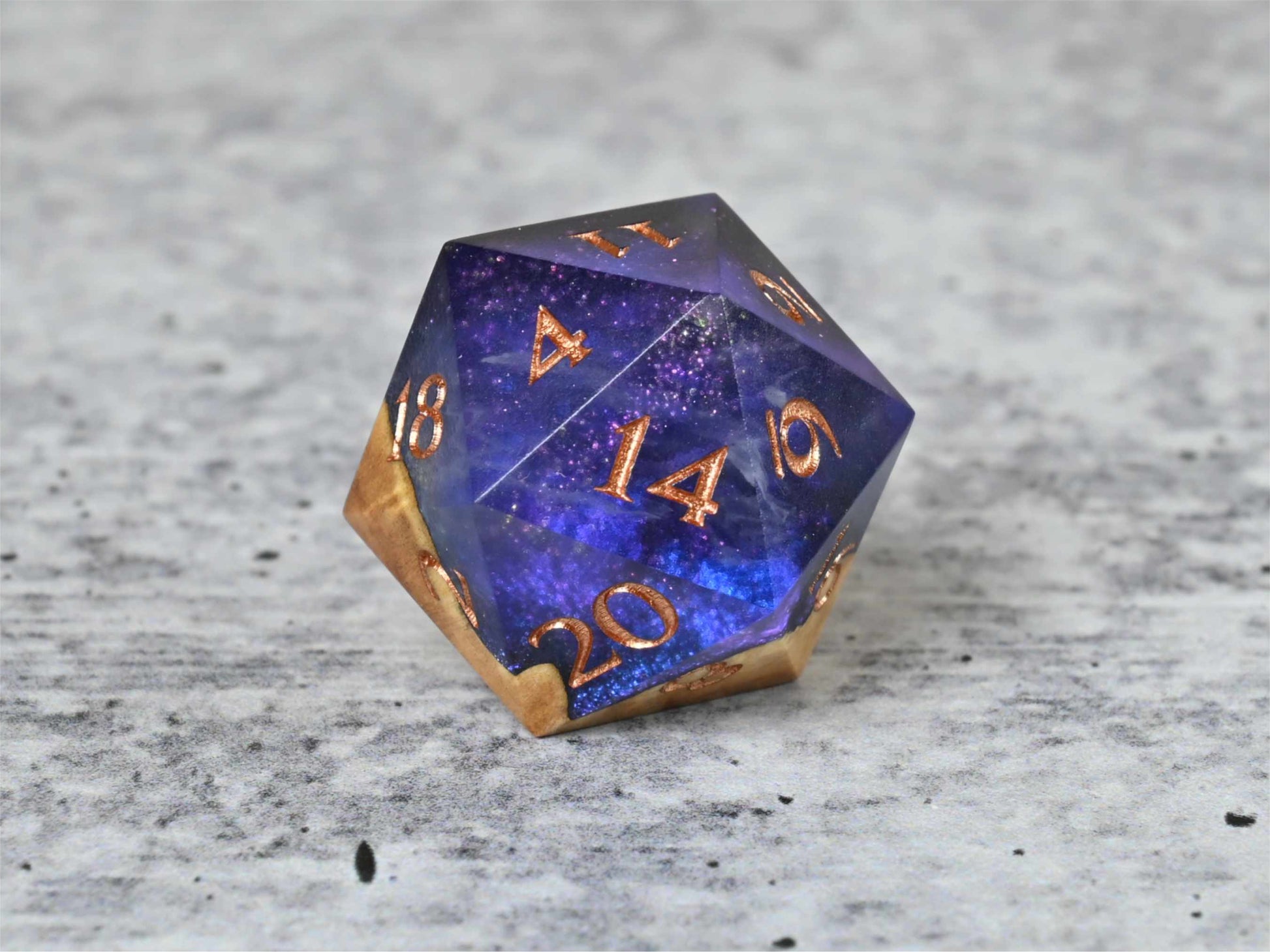 Cloud Nebula Buckeye Burl wood and resin D20 dice with numbers painted rose gold for dnd ttrpg