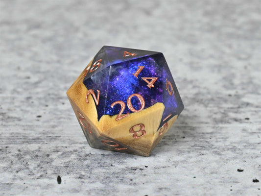 Cloud Nebula Buckeye Burl wood and resin D20 dice with numbers painted rose gold for dnd ttrpg