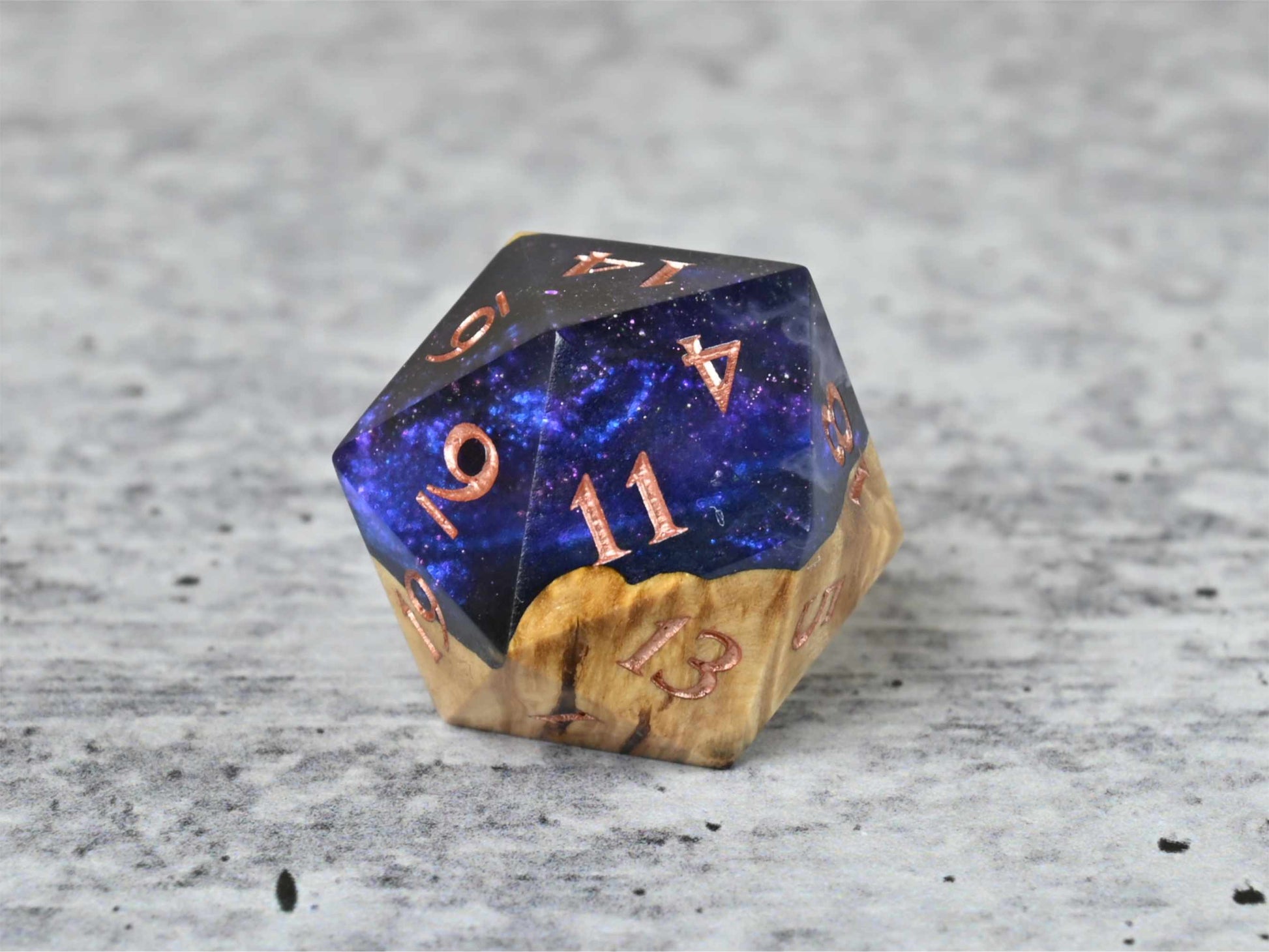 Cloud Nebula Buckeye Burl wood and resin D20 dice with numbers painted rose gold for dnd ttrpg