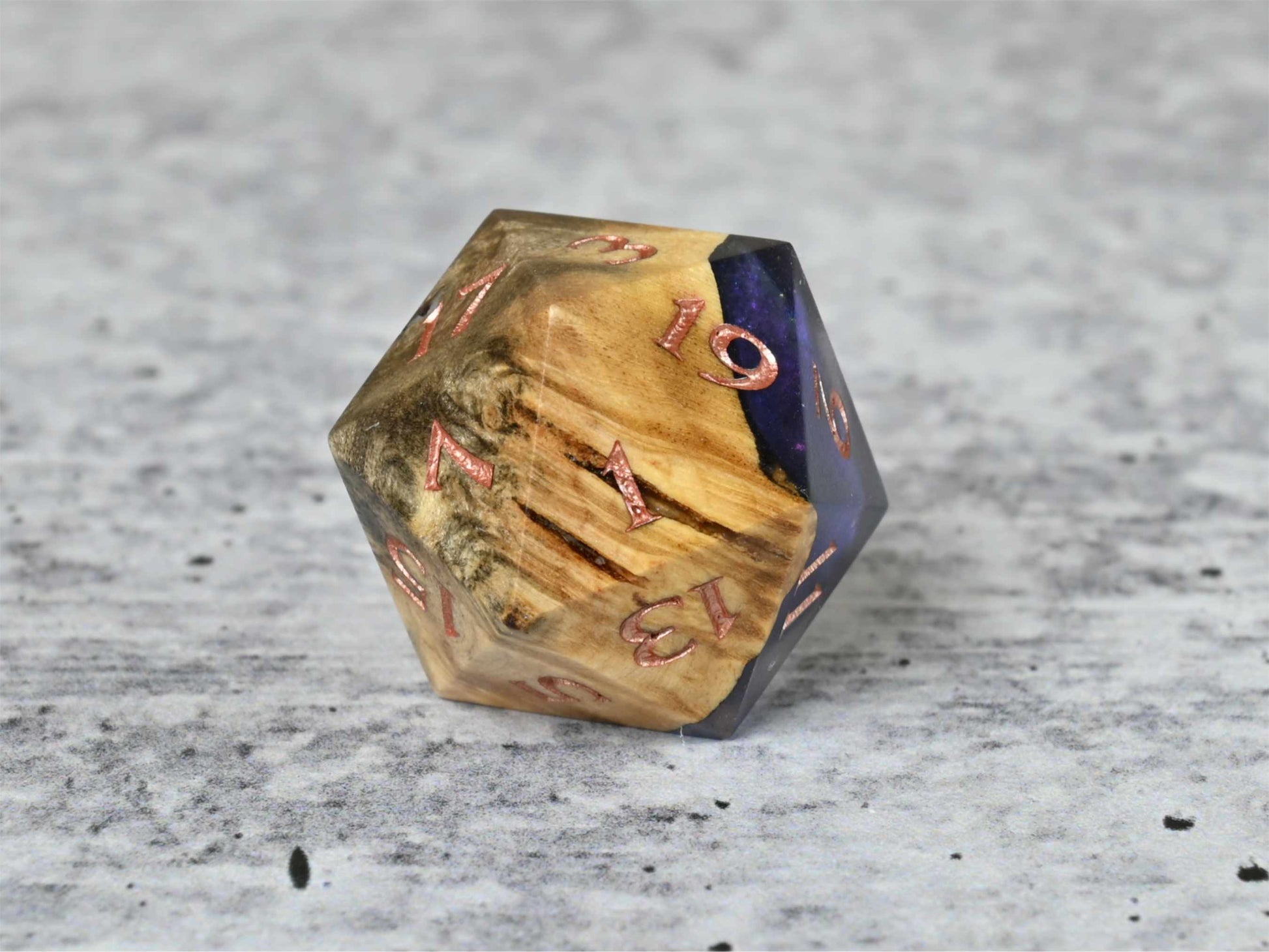 Cloud Nebula Buckeye Burl wood and resin D20 dice with numbers painted rose gold for dnd ttrpg