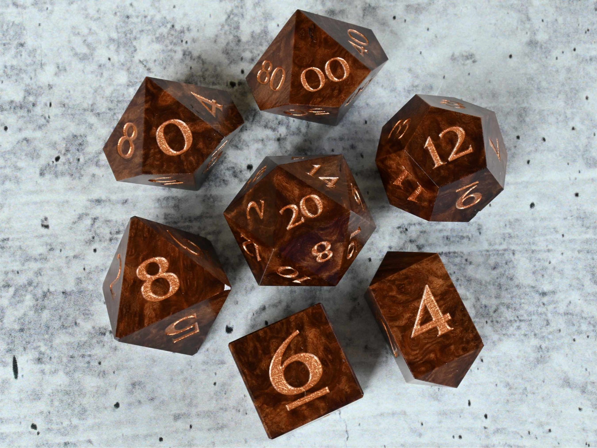 Horistes burl wood dice set with bronze painted numbers for dnd ttrpg