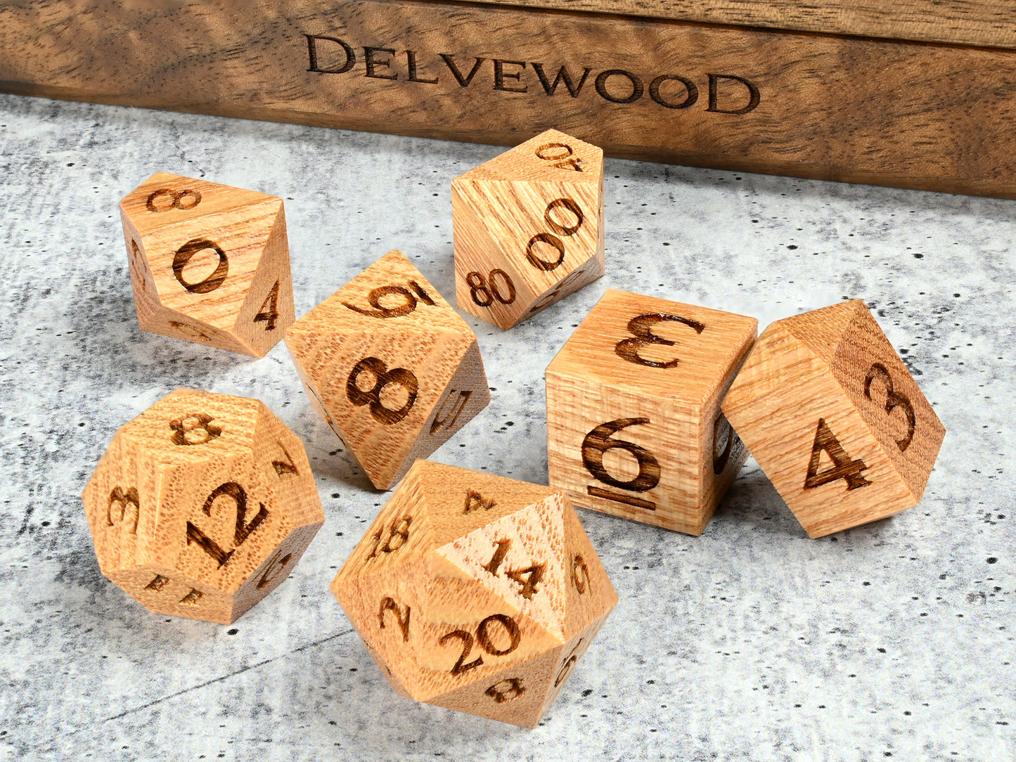 Coffeetree wood dice set for dnd rpg tabletop gaming in front of Delvewood delver's kit dice box.